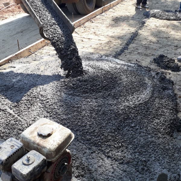 ready mixed concrete pouring on outdoors construction project